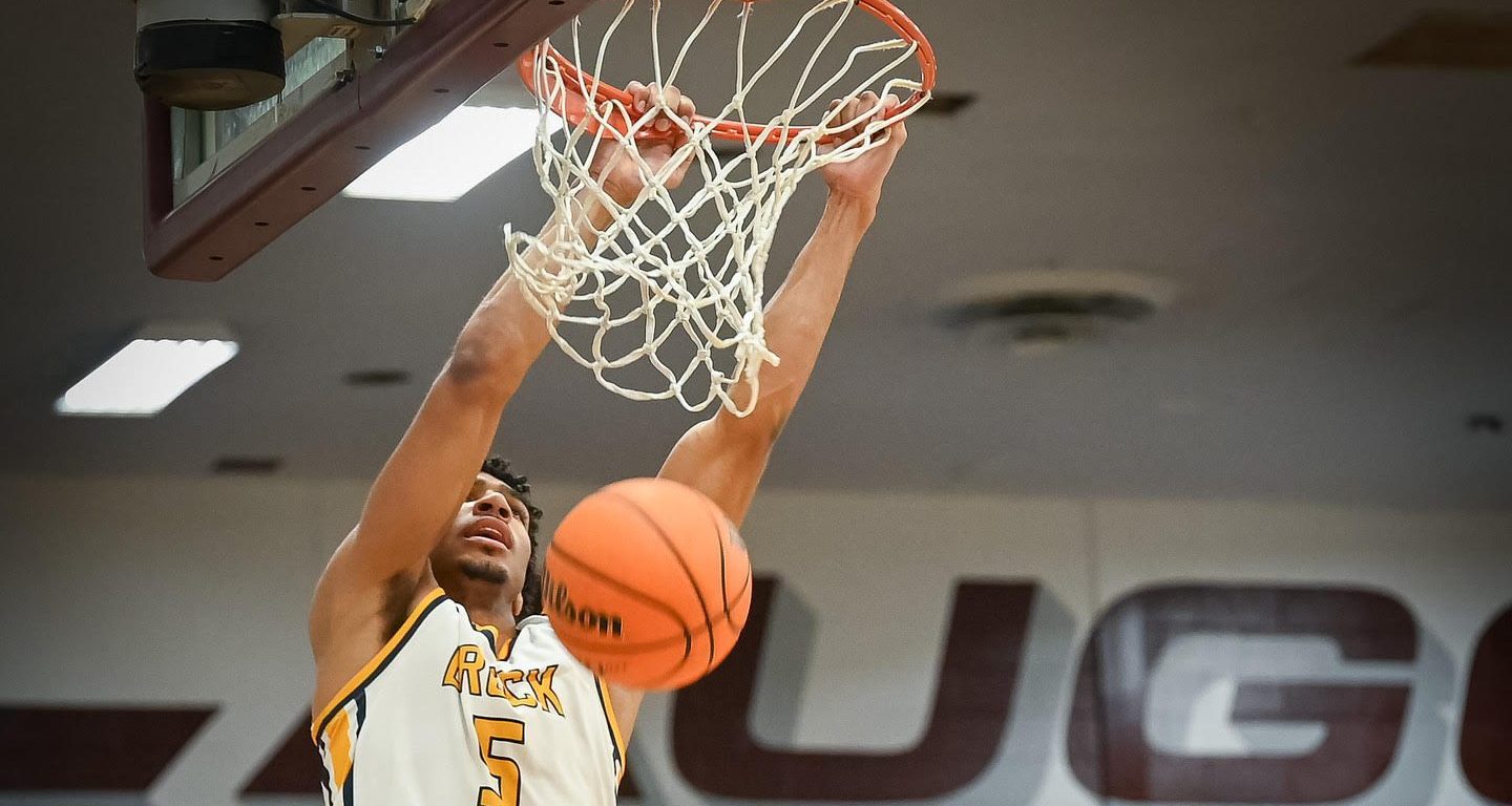 A photo of Daniel Freitag dunking for Breck High School.Daniel Freitag dunks in a game for Breck