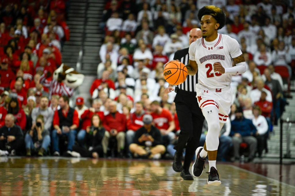 Chucky Hepburn dribbles a ball up the court