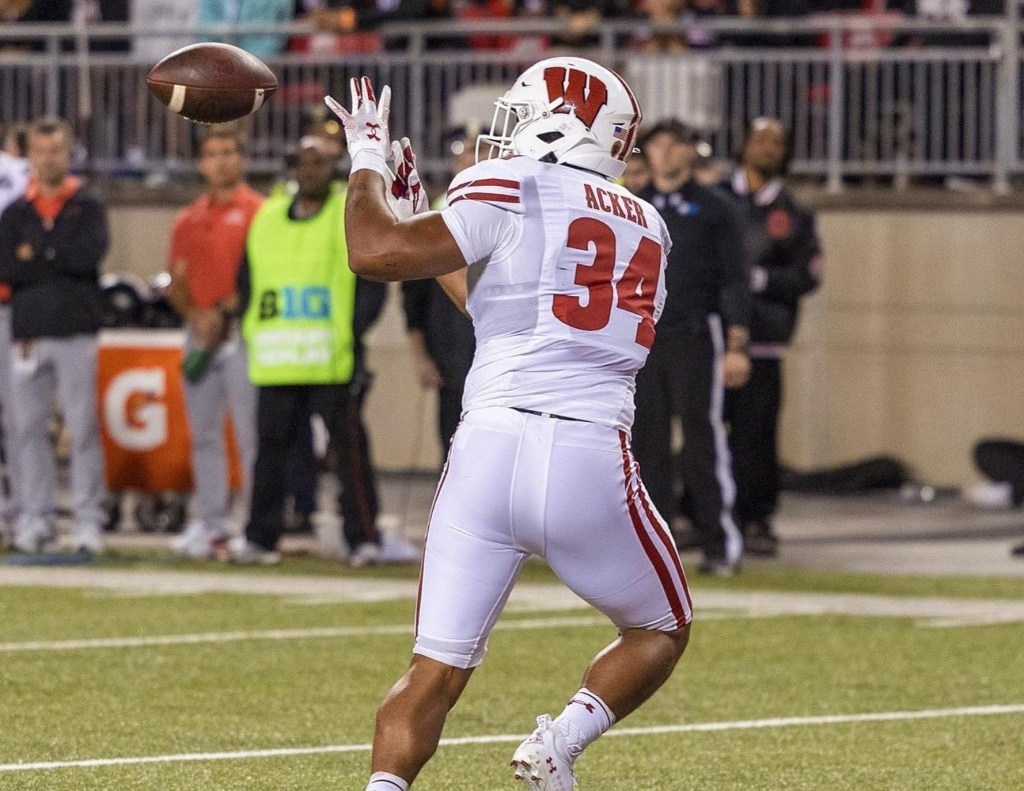 A photo of Jackson Acker holding his hands out to catch a ball during a game in 2022.