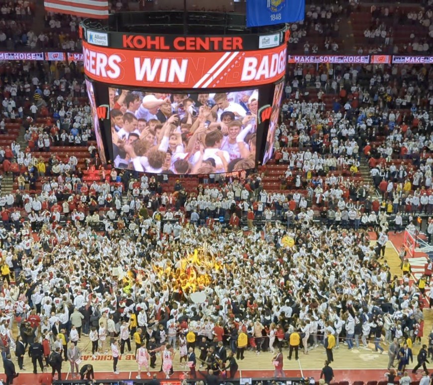 A photo of the students swarming the Kohl Center court.