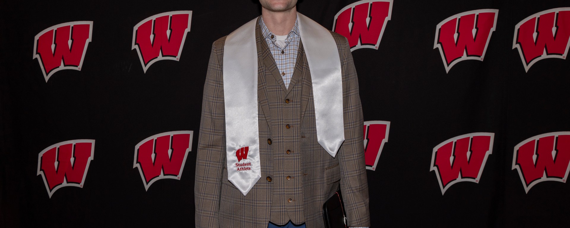 A photo of Tyler Wahl after receiving his master's degree.