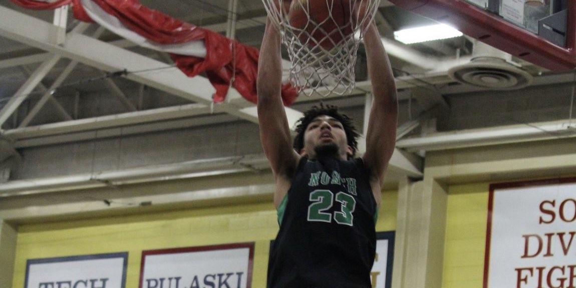 Xzavion Mitchell of Oshkosh North dunks the basketball.