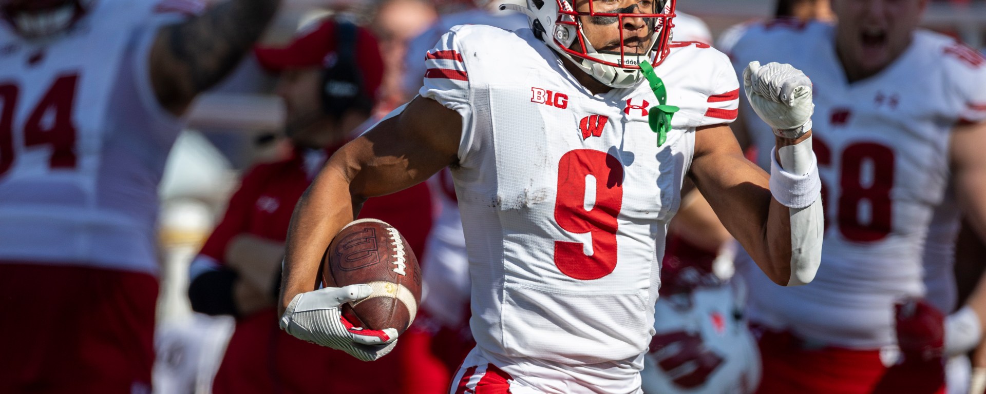 Bryson Green sprinting down the field with the ball in his hand.
