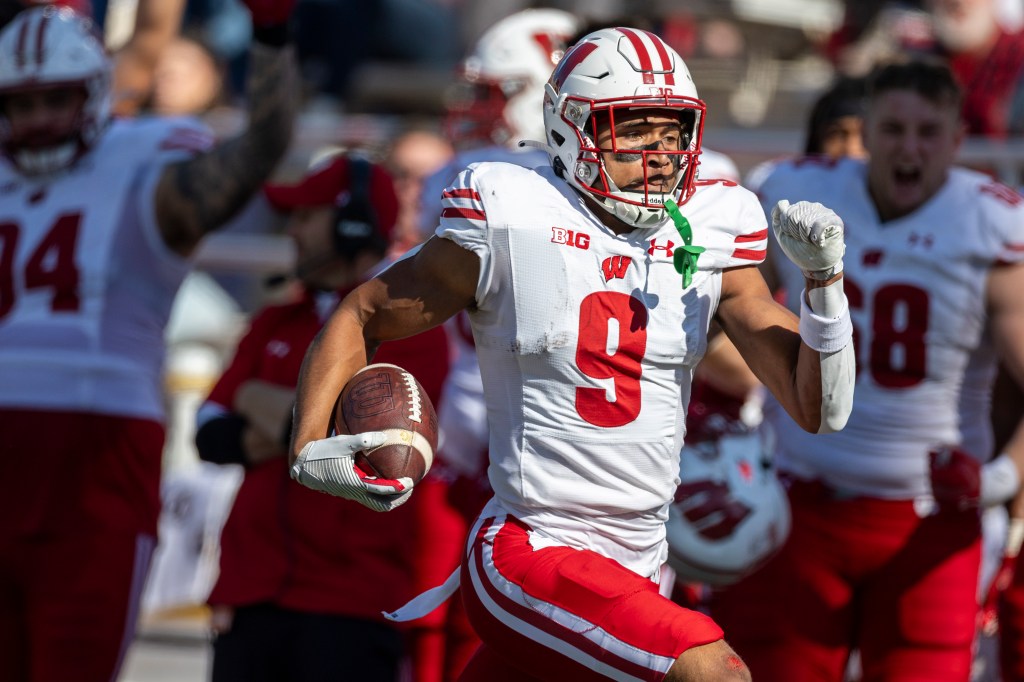 Bryson Green sprinting down the field with the ball in his hand.