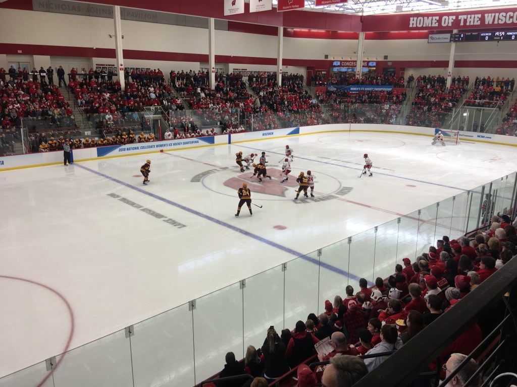The Badgers line up for a faceoff in LaBahn arena.