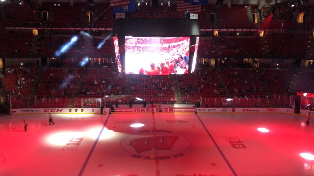 The Kohl Center is dark as the men's hockey team is announced.