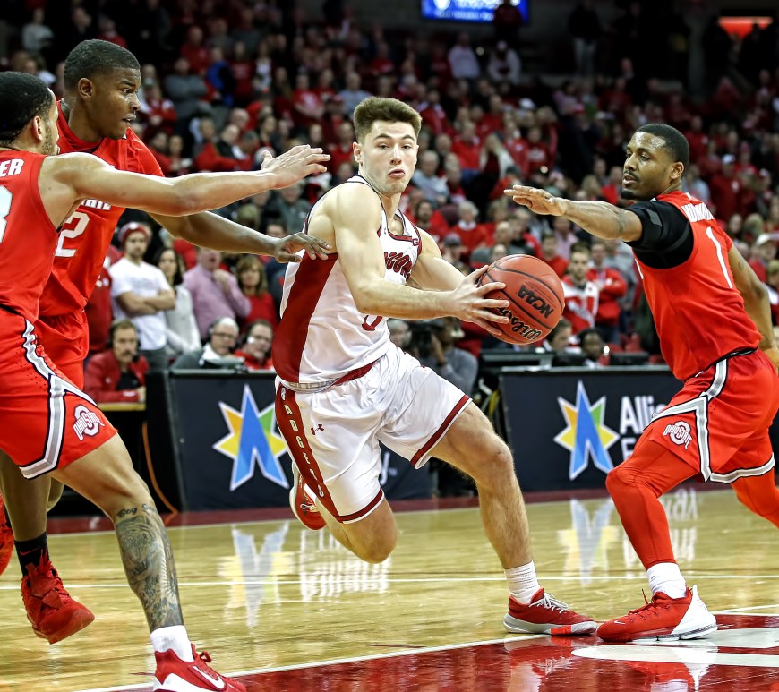 A photo of Walt McGrory driving against OSU.