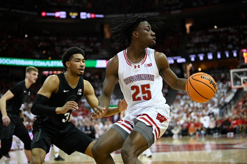 John Blackwell spins around a defender.