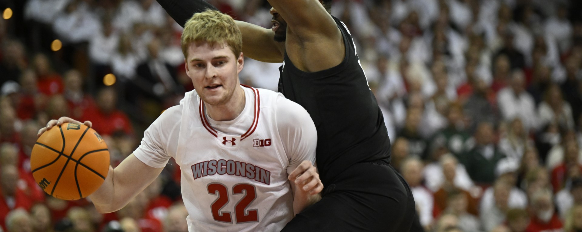 Steven Crowl dribbles the ball inside against a Michigan State defender.