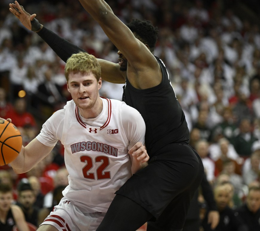 Steven Crowl dribbles the ball inside against a Michigan State defender.